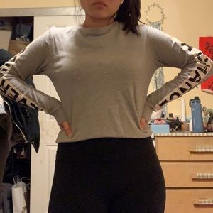 H&M’s “Never miss a chance” gray sweater